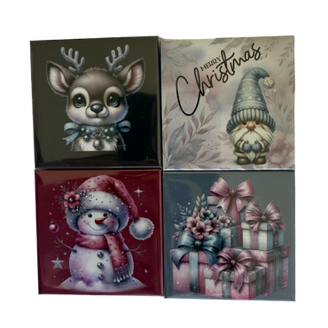 Set of four Christmas-themed cards featuring a reindeer, gnome, snowman, and gift boxes.